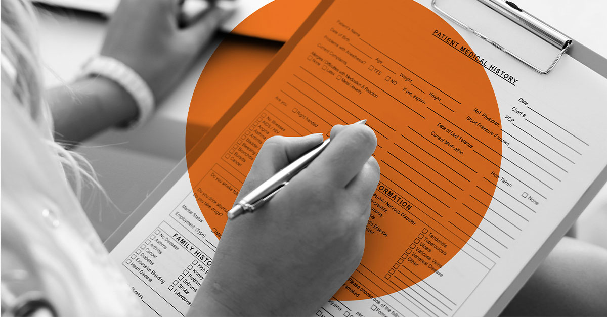 Closeup of hands filling out a Patient Medical History form.