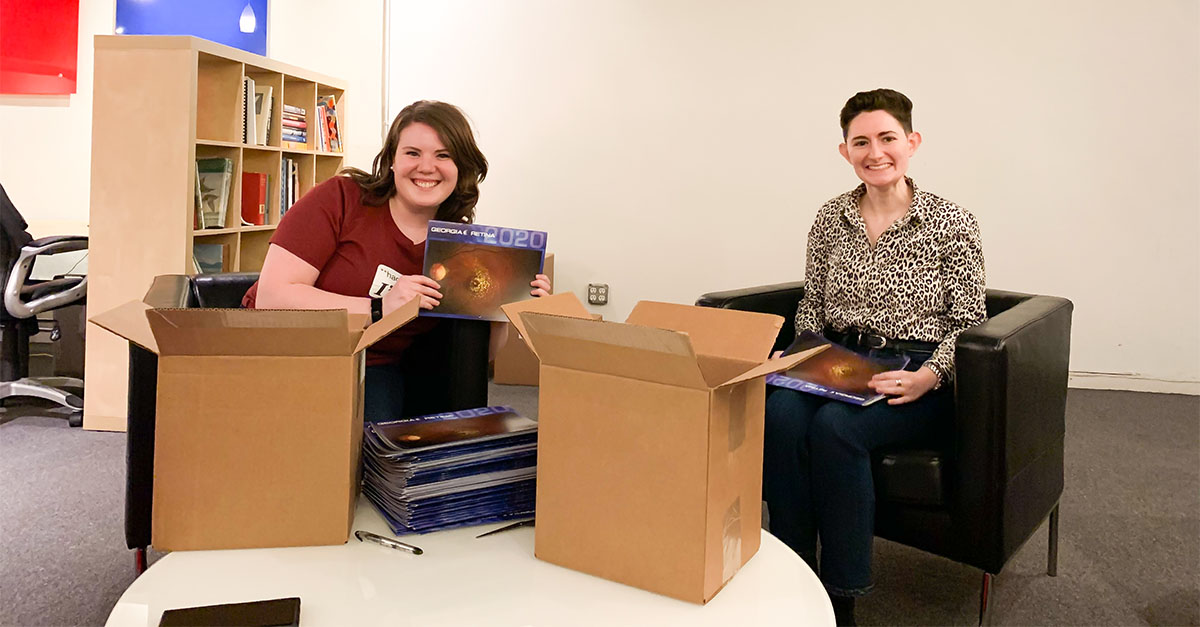 Anna Laura McGranahan and Rae Steinberg of Lenz quality checking Georgia Retina calendars.