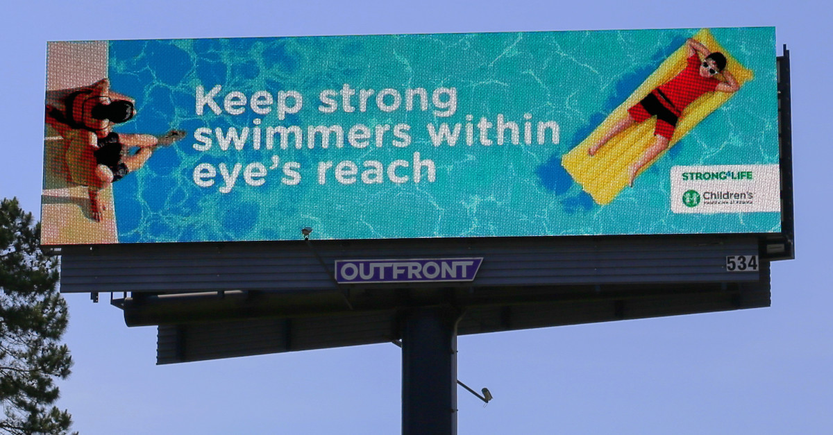 Keep strong swimmers within eye's reach billboard