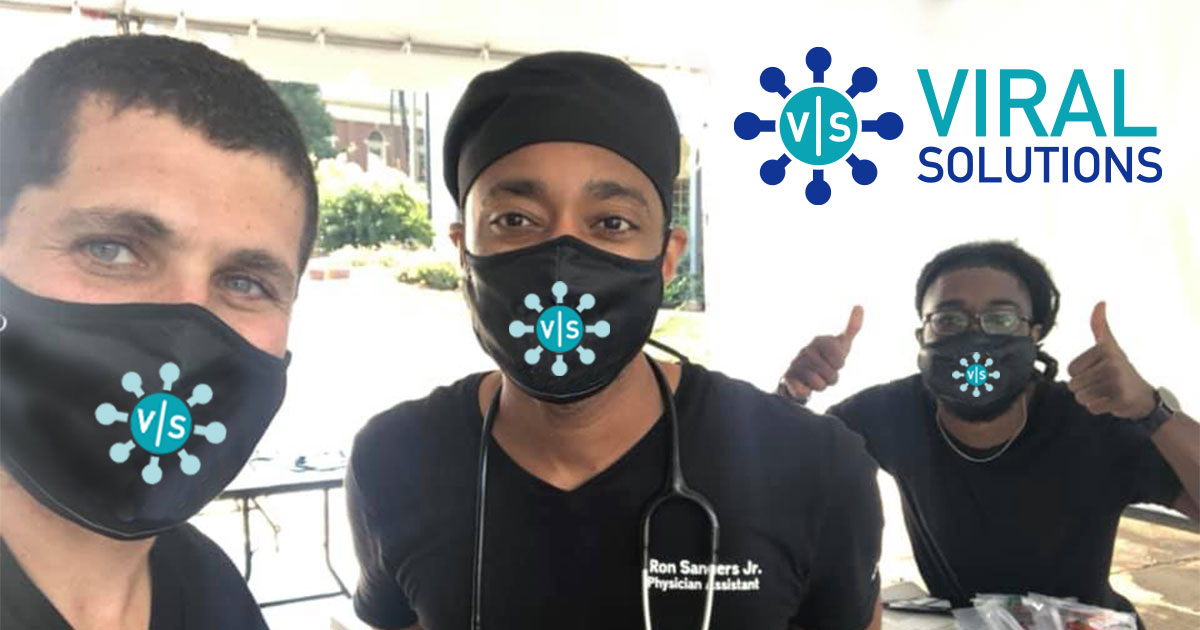 Three men wearing Viral Solutions branded masks and black scrubs