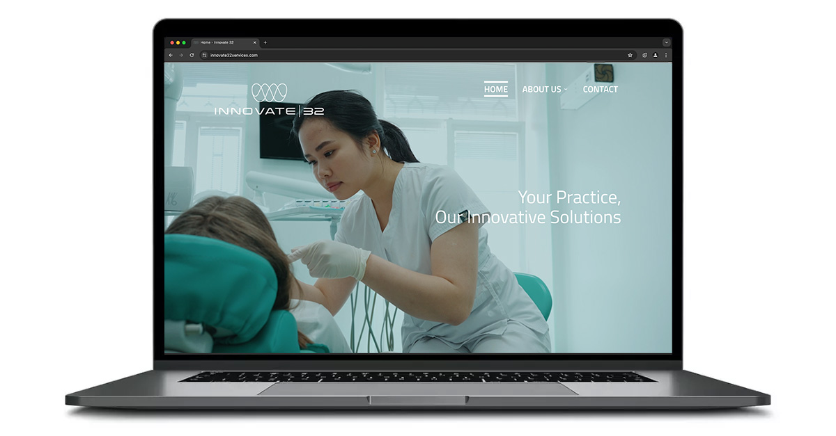 Innovate32Services.comon a laptop screen.